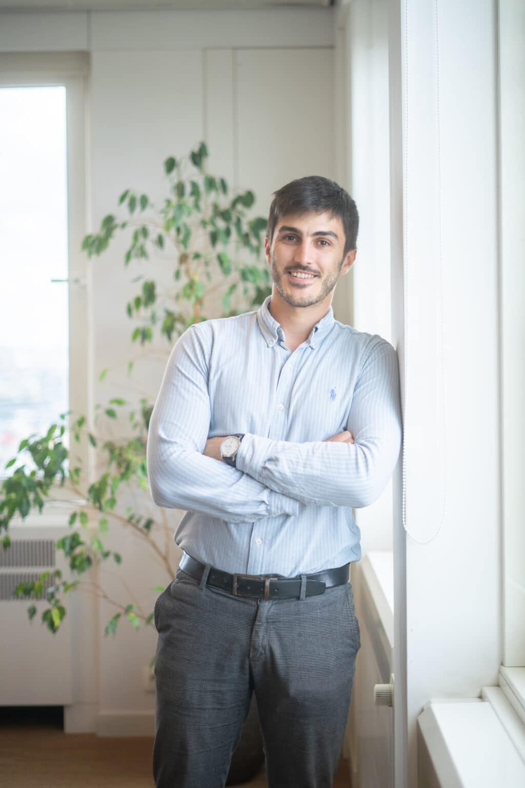 jean-baptiste from dups standing against wall in office