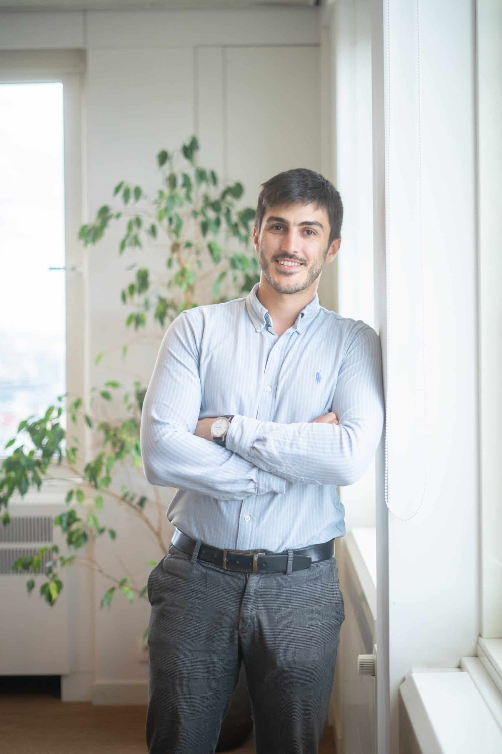 jean-baptiste from dups standing against wall in office